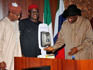 President Jonathan using hand sanitizer