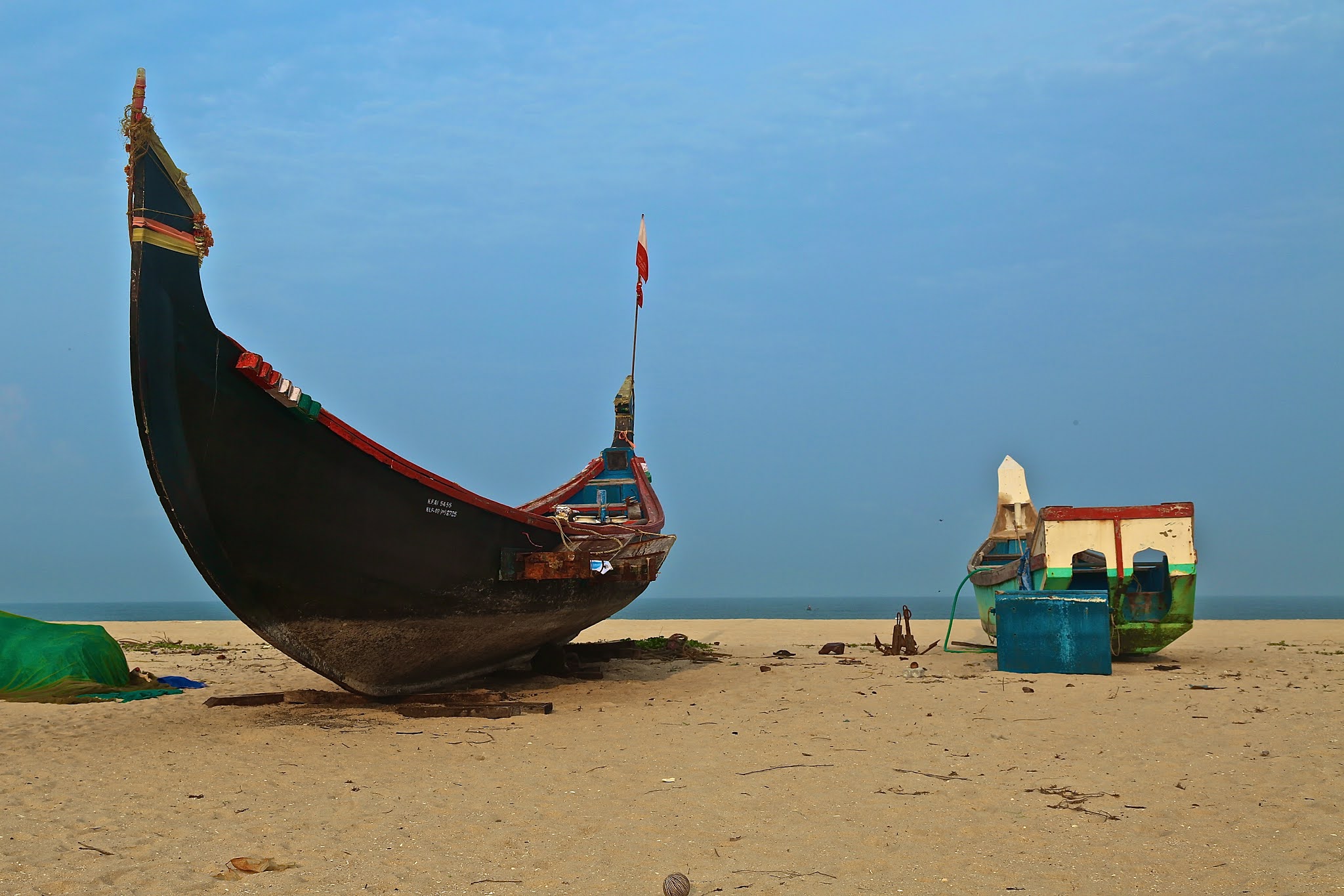 Boats at Chethi Beach, Kerala high resolution free