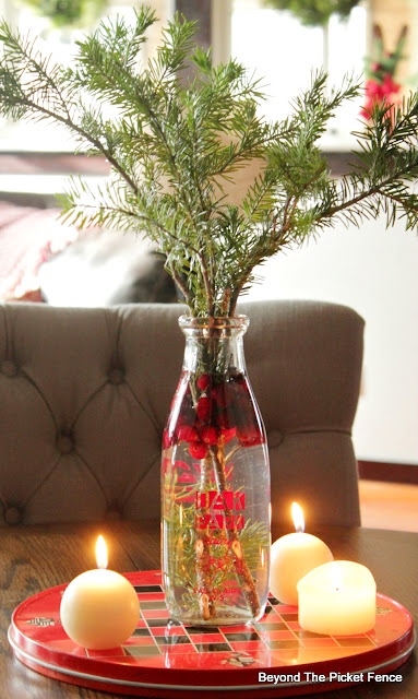 use a metal game board and siple items to make a christmas centerpiece