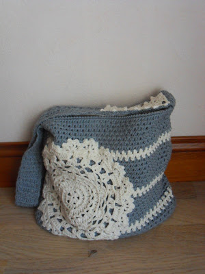 grey crochet bag with a doily