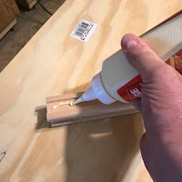 Applying glue to the groove on the post