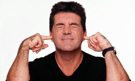 Simon Cowell Plugs Ears