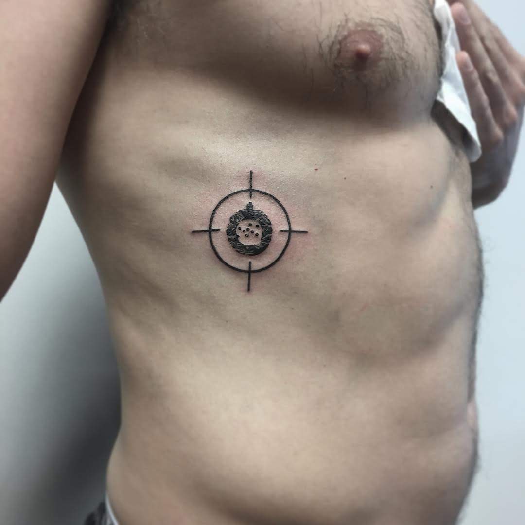 Rib Bullseye Tattoo