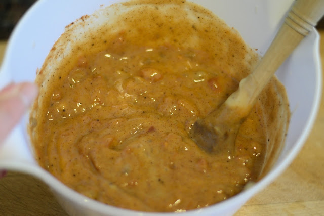 The sauce for the crockpot chicken spaghetti mixed together in a bowl. 