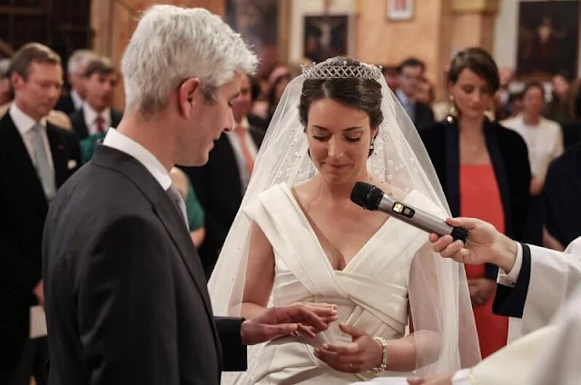 Princess Alexandra wore a wedding gown by Elie Saab. Maria Teresa wore a jumpsuit by Elie Saab. Princess Claire in Zuhair Murad