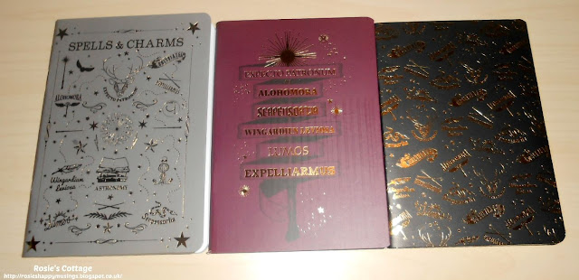 Latest Harry Potter mini haul: A set of three notebooks, all with beautiful, shiny, Potter world themed covers.