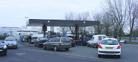 Motorists queuing for fuel just before lockdown.  Indre et Loire, France. Photographed by Susan Walter. Tour the Loire Valley with a classic car and a private guide.