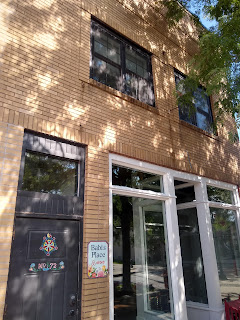 Doorway to brick building, Airbnb sign