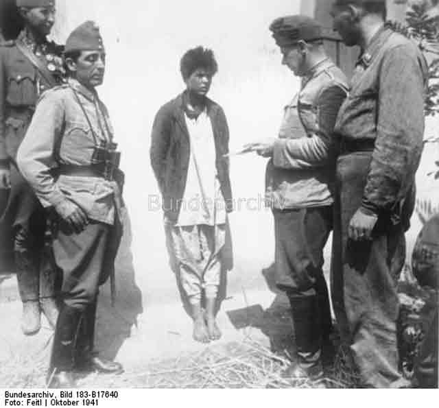 Soviet spy being questioned by Hungarian troops,19 October 1941 worldwartwo.filminspector.com