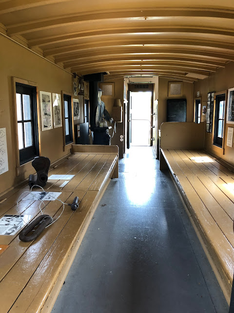 Climbing into the caboose at Batavia Depot Museum.