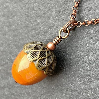 Handmade lampwork glass acorn necklace by Laura Sparling