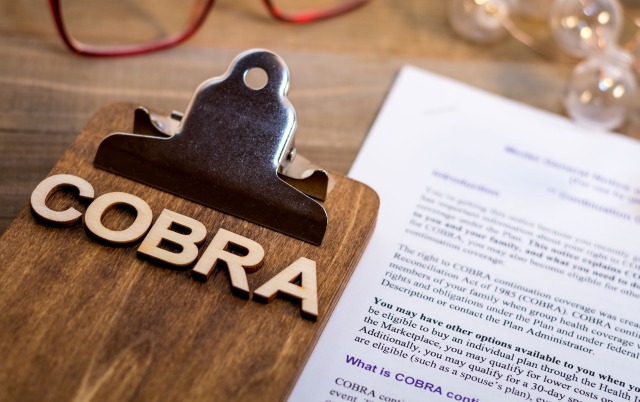 COBRA paperwork on a table