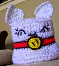 http://www.ravelry.com/patterns/library/happy-kitty-toilet-paper-cozy