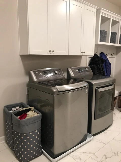 laundry with gray washer and dryer