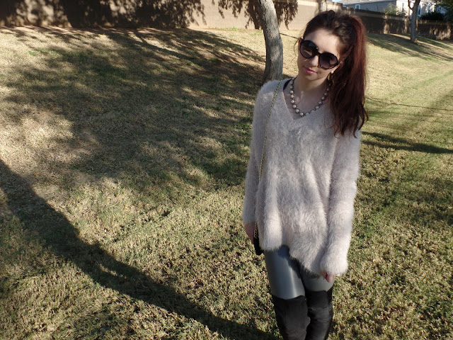 fuzzy pale pink oversize sweater with leggings and over the knee boots