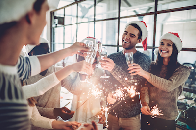 Office employees celebrating the holidays