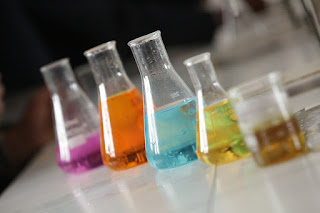 Practice Tests: Beakers filled with different colored liquids. Photo from https://pixabay.com/photos/chemistry-lab-experiment-chemist-3533039/