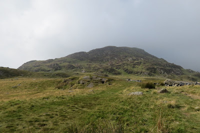 A rocky dome forming a minor summit on the mountain.