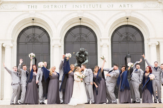 bridal party at Detroit Institute of Arts kissing