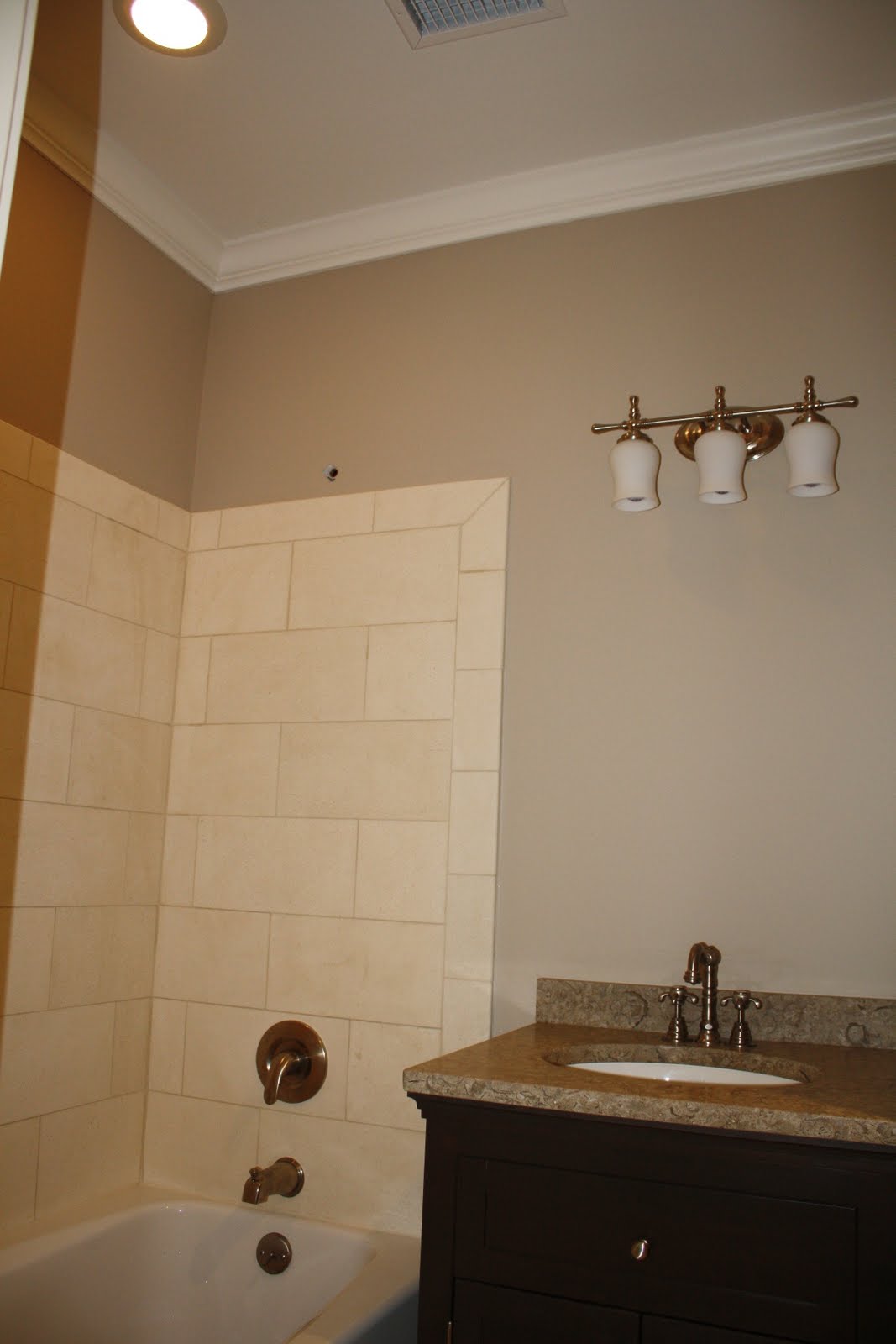 bathroom shower paint Guest bath complete with light, paint, crown molding, shower tile 