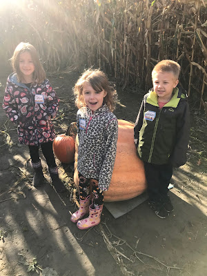 students and a big pumpkin