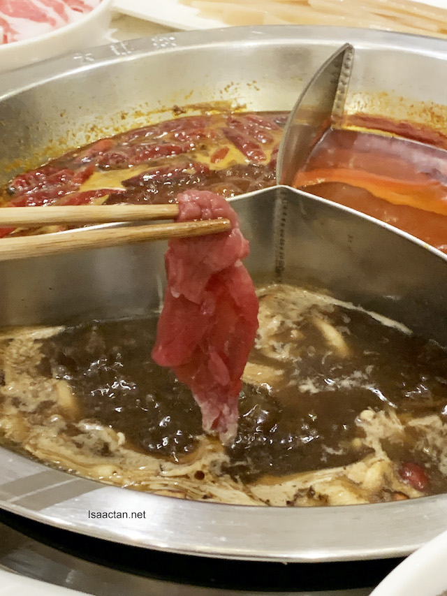 Da Long Yi’s Tri-pot consisting of signature Mala spicy soup base, tomato and mushroom soup.