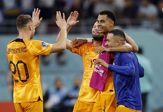 Soccer Football - Khalifa International Stadium, Doha, Qatar - December 3, 2022 - Round of 16 - Netherlands vs. United States Netherlands' After the game, Teun Koopmeiners, Daley Blind, Cody Gakpo, and Memphis Depay celebrate Netherlands' advancement to the quarterfinals.