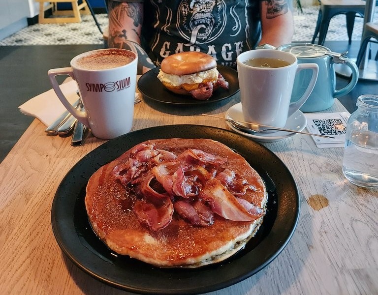 Bacon and maple syrup pancake and coffee at Symposium coffee house