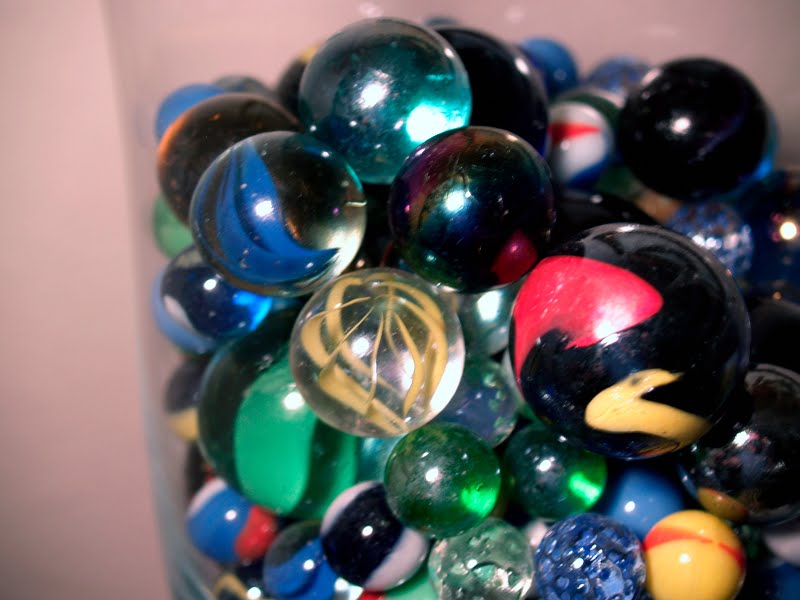 Marbles In Jar. A glass jar is a