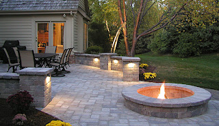 patio with firepit and lighting features