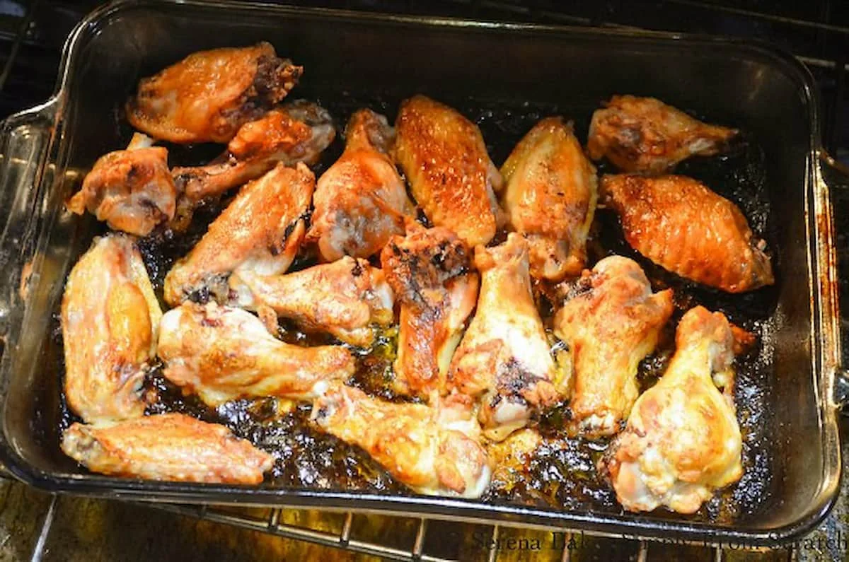 Honey Chipotle Baked Chicken Wings in a glass baking pan in the oven.