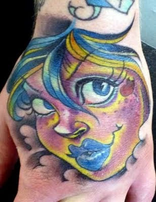 Close-up Face Tattoo on Hand