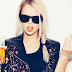 Girl with sunglasses holding her delicious refreshment