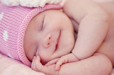 pink-baby-sleeping-and-smilling-images