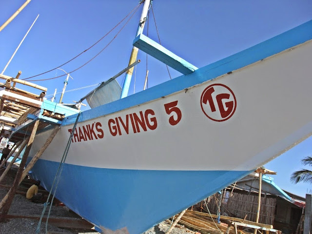 close-up shot of the outside hull of a boat under construction named "Thanks Giving 5" at San Jose Occidental Mindoro