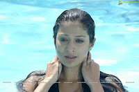 Alluring LAKSHMI RAI spicy stills,cleavage show, hot in tamil actress photos, swimming pool pics, wet and sexy in pool, pole dance