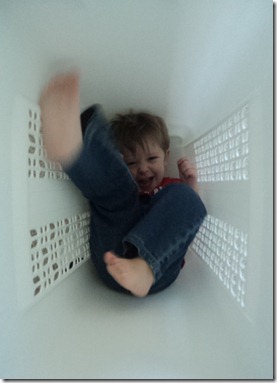 feet moving in laundry basket