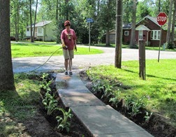 1407174 July 15 Barb Washing Mud Off Sidewalk