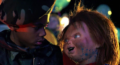 Chucky the doll (Brad Dourif) taunts Tyler (Jeremy Sylvers) into being the host for his soul transfer in Child's Play 3