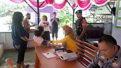 Babinsa 1314-02/Atinggola Bersinergi Memberikan Pengamanan dan Pelayanan Di Pos Pam Lebaran Di Jl. Trans Sulawesi Desa Kotajin