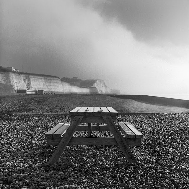 A picnic bench on a beach in Saltdean East Sussex