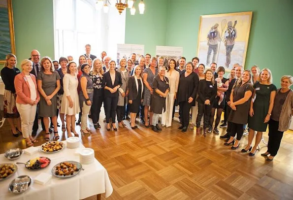 Crown Princess Mary attended a reception of 10th anniversary of establishment of Intergroup Parliamentarian Network. Pricess Mary wore pants, blouse, shoes style