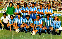C. D. MÁLAGA. Temporada 1983-84. Fernando, Popo, Brescia, Canillas, Urdaci y Regenhardt. Juan Carlos, Recio, Totó, Martín y José. C. D. MÁLAGA 6 REAL MADRID C. F. 2 Domingo 11/09/1983. Campeonato de Liga de 1ª División, jornada 2. Málaga, estadio La Rosaleda. GOLES: 1-0: 20’, Toto. 2-0: 43’, Martín. 3-0: 53’, Martín. 3-1: 64’, Juanito, de penalti. 4-1: 69’, Canillas. 5-1: 76’, Martín, de penalti. 5-2: 82’, Juanito. 6-2: 87’, Hurtado.