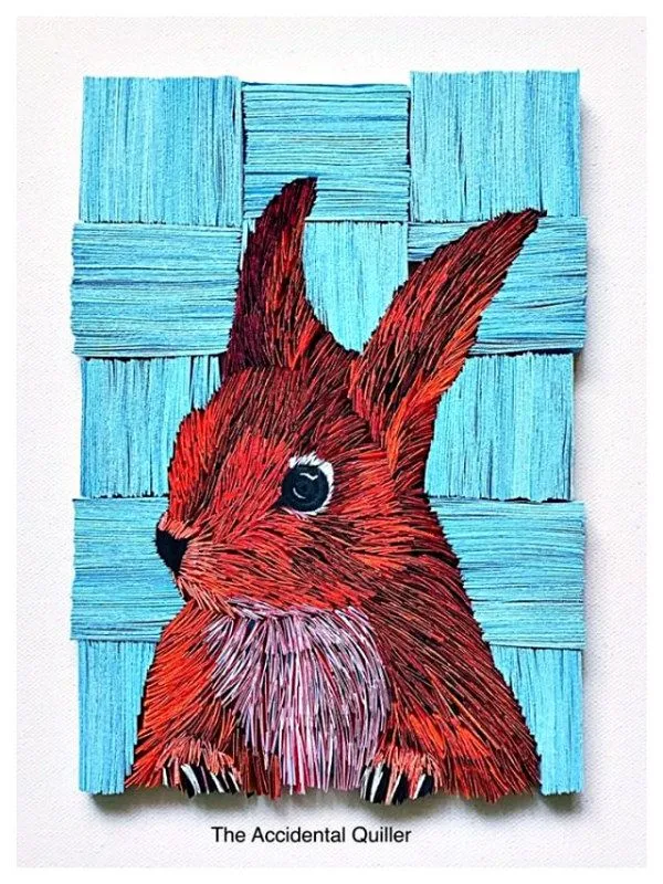 layered paper rabbit wall art composed of paper strips