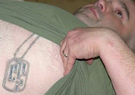 tattoos of vital information in a replica image of soldiers' dog tags.
