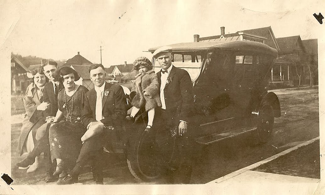 This is a great photo my Dad says the car is a 1929 Chevy