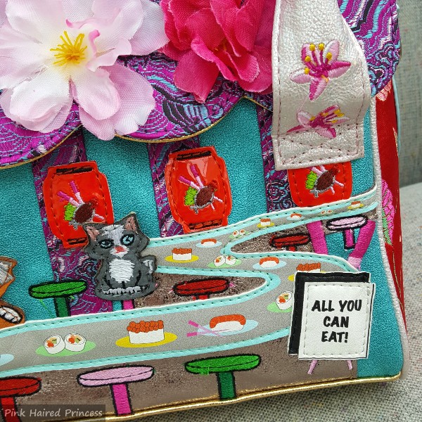 cat sushi bar applique detail on front of handbag