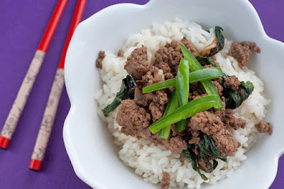 Bowl of beef and rice with fresh chili peppers