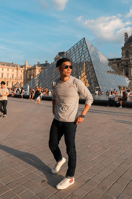 Leo Chan outside of the Louvre Museum in Paris