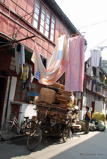 Laundry and load in an alley, Shanghai, China